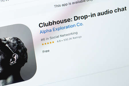 Clubhouse mobile app on screen notebook, macro. Clubhouse drop in audio chat is a social network...