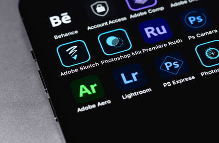 Adobe services mobile apps on screen smartphone closeup. Adobe Systems Incorporated is an American multinational computer software company. Moscow, Russia - January 11, 2021のeditorial素材