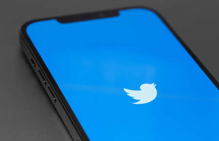 Twitter mobile logo app on screen smartphone, iPhone. Twitter is a social media online service for microblogging and networking communication. Moscow, Russia - January 23, 2021のeditorial素材