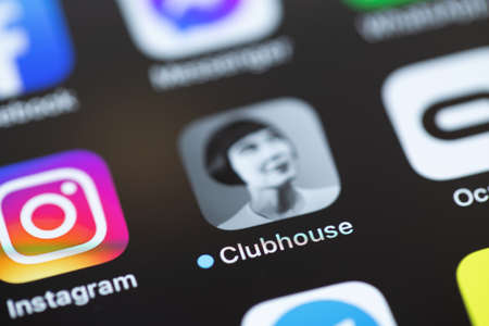 Clubhouse app on screen smartphone, iPhone interface macro. Clubhouse is a social network based on voice communication. Moscow, Russia - April 26, 2021のeditorial素材