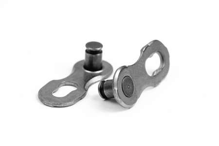 bicycle chain, macro chain connector or missing link for quick link connection on white background