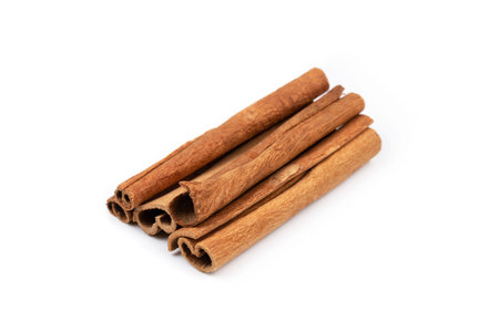 aromatic dry cinnamon sticks isolated on white backgroundの写真素材
