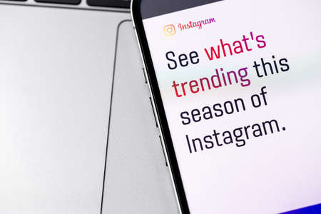Instagram trending - offical website on screen smartphone closeup. Instagram is a photo-sharing app for smartphones. Moscow, Russia - November 9, 2021のeditorial素材