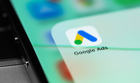 Google Ads mobile app on the screen smartphone iPhone closeup. Ads is a service of contextual,...
