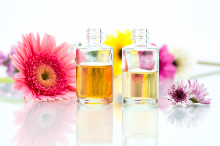 Organic Spa concept with essential oil and pink Flowersの写真素材