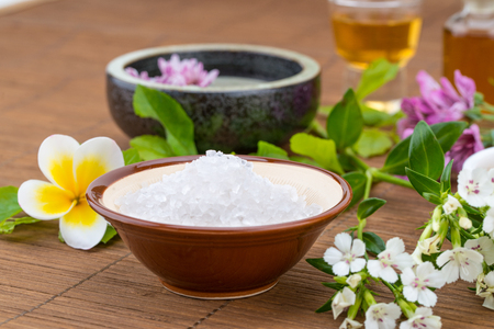salt bowl, essential oil,  flower float on water china background for health spaの写真素材