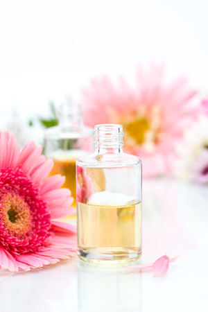 Organic Spa concept with essential oil and pink Flowersの写真素材