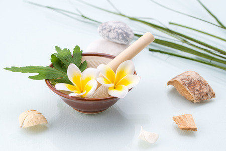 Organic Spa concept with Mortar and Pestle, Flowers, leaf and stoneの写真素材