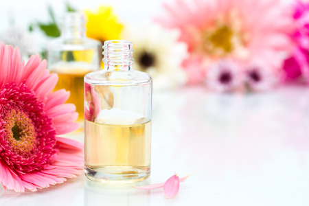 Organic Spa concept with essential oil and pink Flowersの写真素材