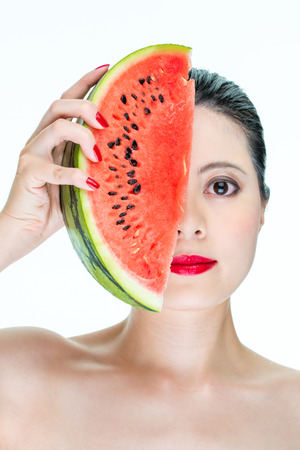 Fashion woman model holding watermelon with red lips, Nail Polish, Cross Section, beautyの写真素材