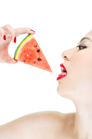 woman desire eating watermelon with red lips, fashionの写真素材