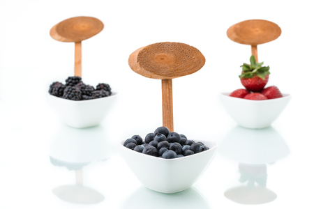 fresh blueberries, Blackberry, strawberry with signboard in bowlsの写真素材