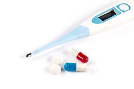 thermometer with pills and Capsule, Fever headache flu unwellの写真素材