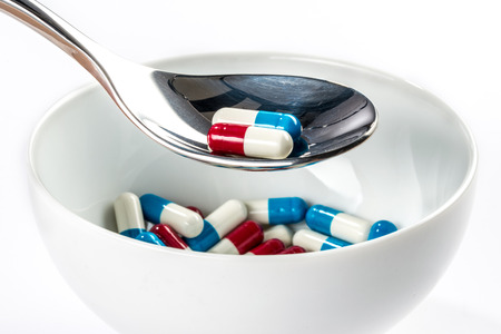 Capsule on bowl with Spoon medicine meal, Dieting  lose weightの写真素材