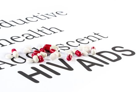 Reproductive health by Adolescent, AIDS HIV, medication sickness capsule on paperの写真素材