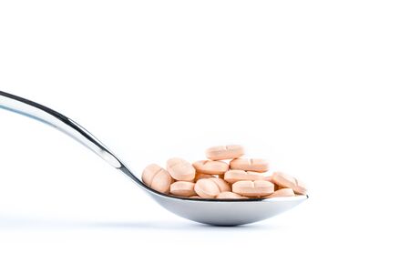 Capsules in silver spoon, Healthcare and Medicine medication close upの写真素材