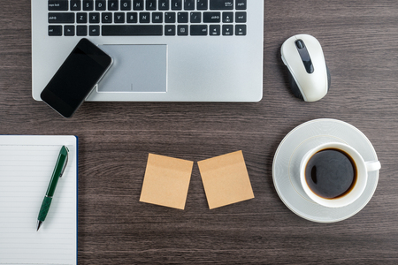 laptop, Notebook, Adhesive Note and smart phone with cup of coffeeの写真素材