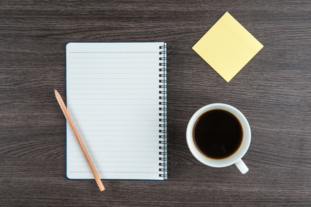 Notebook with pencil Adhesive Note and cup of coffee, Planningの写真素材