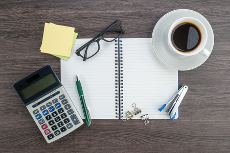 notebook Calculator Stapler and cup of coffee, workplaceの写真素材