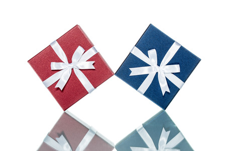 luxury color gift box for holiday event with beautiful silk wrap on white background isolatedの写真素材
