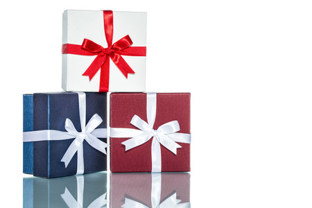 luxury color gift box for holiday event with beautiful silk wrap on white background isolatedの写真素材