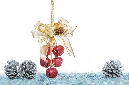 Luxury red jingle Bells and Pine Cone with Snow, hanging Decoration, isolated on whiteの写真素材