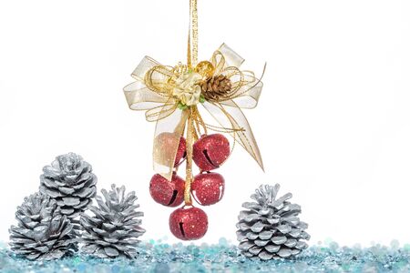 Luxury red jingle Bells and Pine Cone with Snow, hanging Decoration, isolated on whiteの写真素材