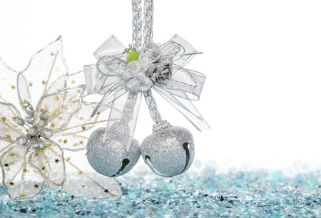 Luxury Silver jingle Bells and flower on Snow, hanging Decoration, isolated on whiteの写真素材