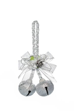 Luxury Silver jingle Bells with bowknot, hanging Decoration, isolated on whiteの写真素材