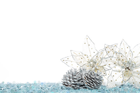 Silver Pine Cone with christmas decoration flower on Snow, isolated on whiteの写真素材