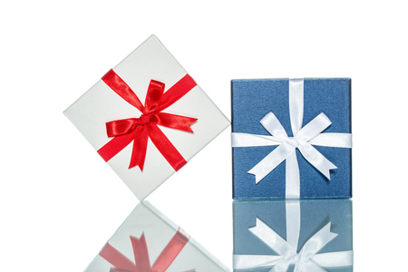 luxury color gift box for holiday event with beautiful silk wrap on white background isolatedの写真素材