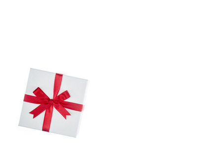luxury color gift box for holiday event with beautiful silk wrap on white background isolatedの写真素材