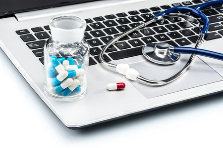Medical Research, stethoscope and Capsule on laptop keyboard, doctor workplaceの写真素材