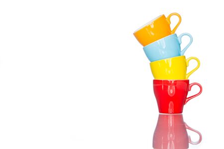 enjoy multiple colorful coffee cup mug on reflection table white  backgroundの写真素材
