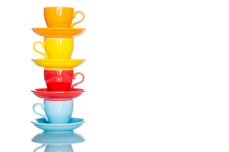 enjoy multiple colorful coffee cup mug on reflection table white  backgroundの写真素材