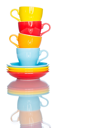 enjoy multiple colorful coffee cup mug on reflection table white  backgroundの写真素材