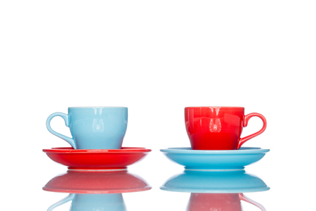 enjoy multiple colorful coffee cup mug on reflection table white  backgroundの写真素材