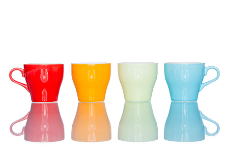 enjoy multiple colorful coffee cup mug on reflection table white  backgroundの写真素材