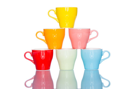 enjoy multiple colorful coffee cup mug on reflection table white  backgroundの写真素材