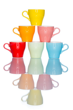 enjoy multiple colorful coffee cup mug on reflection table white  backgroundの写真素材