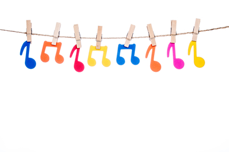 clips on a twine with hanging colorful music symbolの写真素材