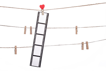 heart shape clip on a clothesline with hanging Negativesの写真素材