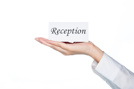 woman hand holding reception card on white backgroundの写真素材