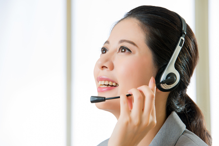 Beautiful asain business customer service woman smiling in officeの写真素材