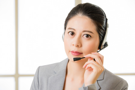 Beautiful asian business customer service woman smiling in officeの写真素材