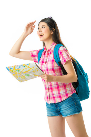 Happy asian woman tourist with map on white backgroundの写真素材