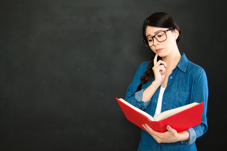 intelligent creativity university student thinking how to solve the question with textbookの写真素材