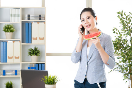 asian business woman happy to talk with you for this summer timeの写真素材