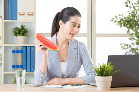 asian business woman feels great to have made it in summer seasonの写真素材