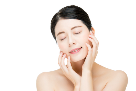 Beautiful asian woman touch her beauty face, isolated on white backgroundの写真素材